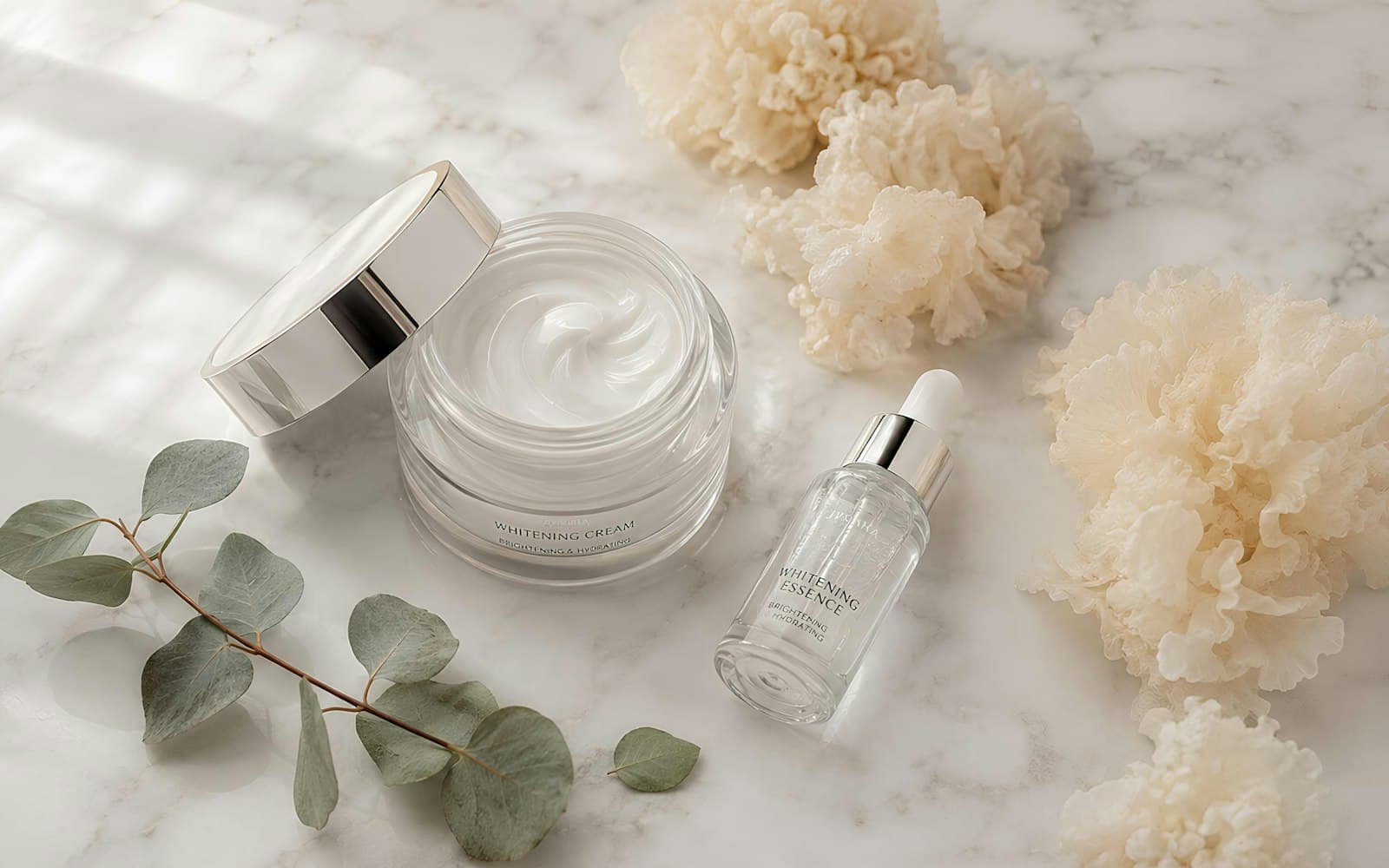 Four skincare products in order of use on a bathroom counter, from cleanser to sunscreen